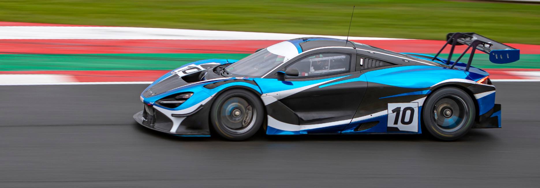Race car branding with blue and black livery and the number 10 display