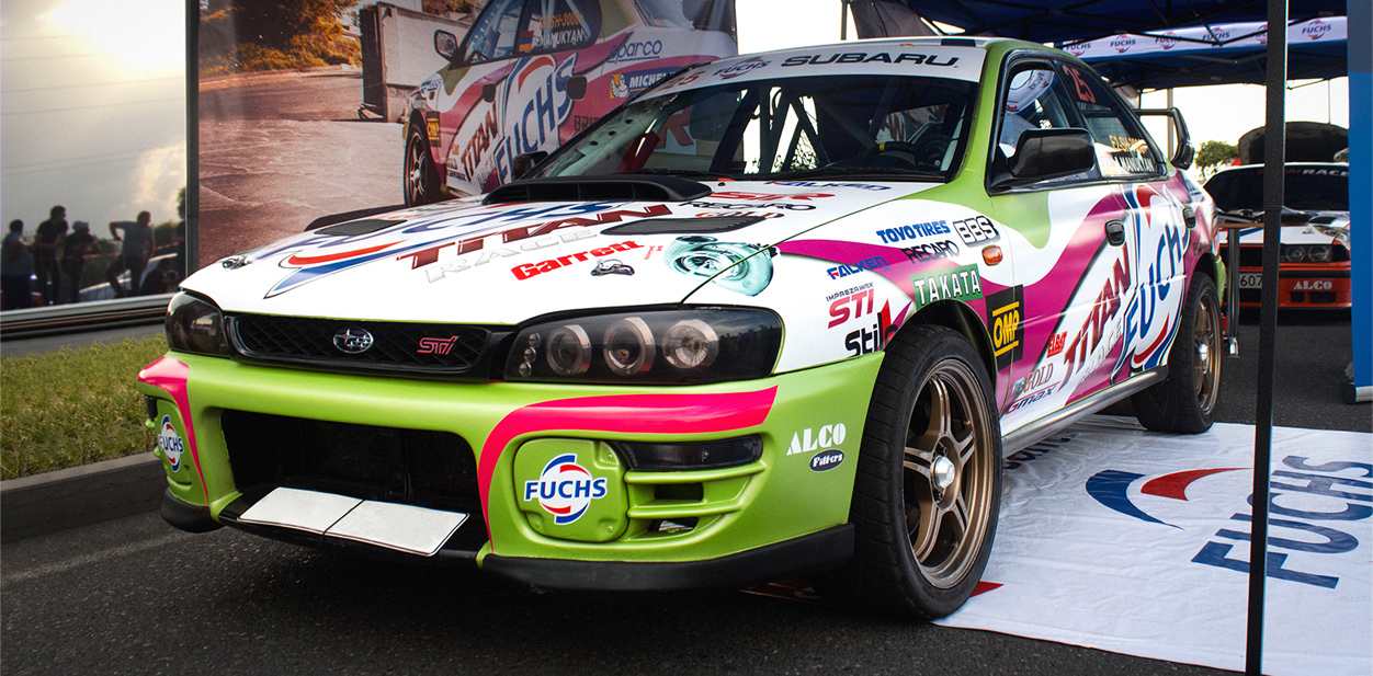 Colorful race car wrap design displaying sponsors' names