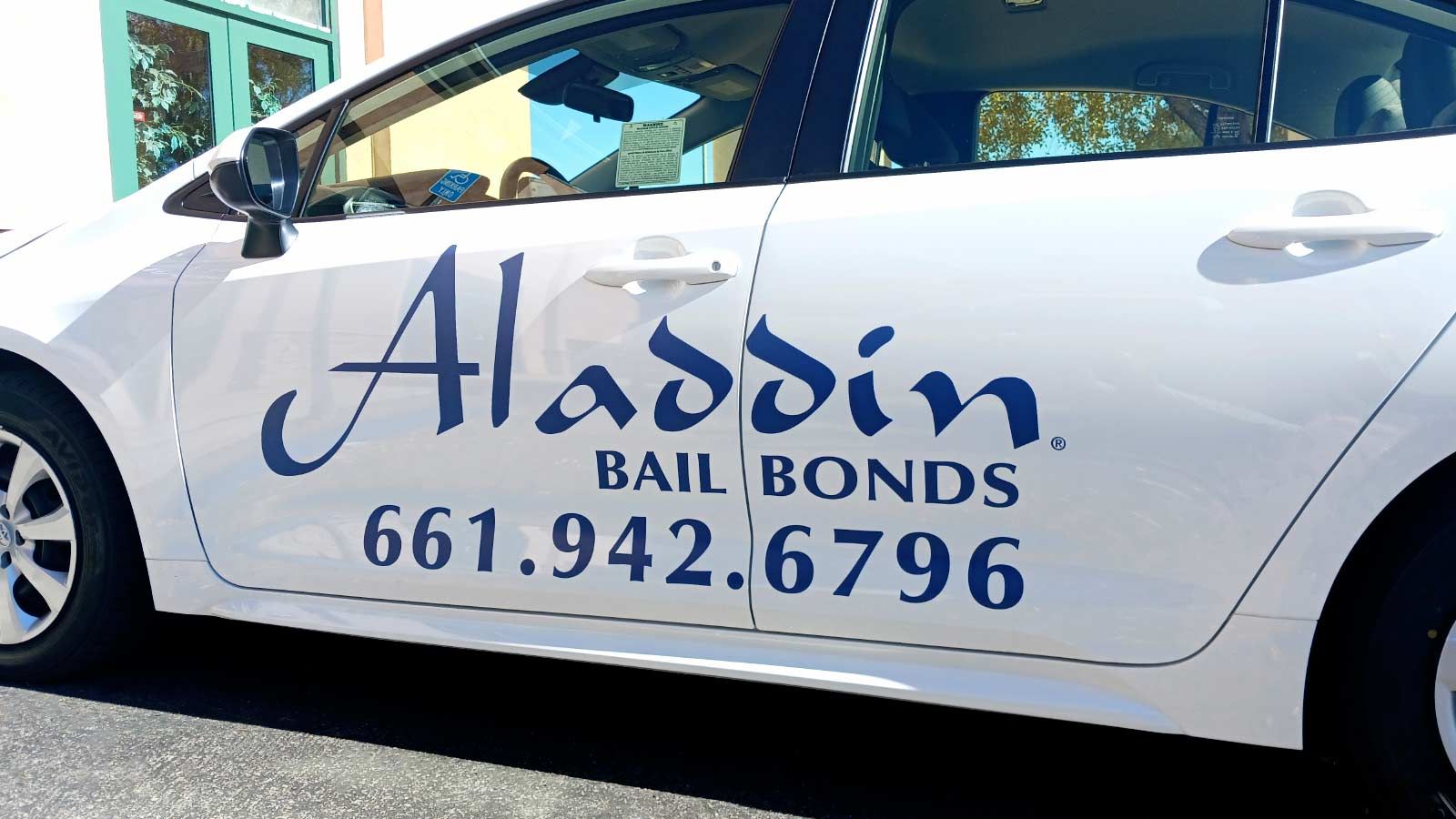 Aladdin Bail Bonds car wrap applied to the car doors