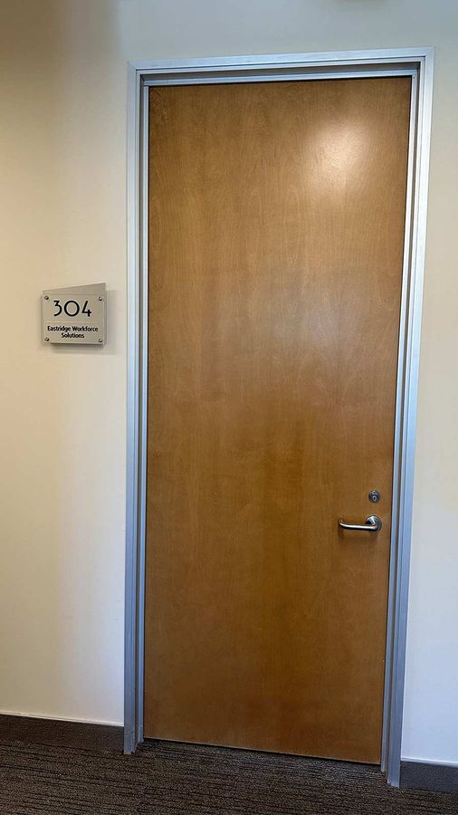 Aluminum sign mounted on the interior wall