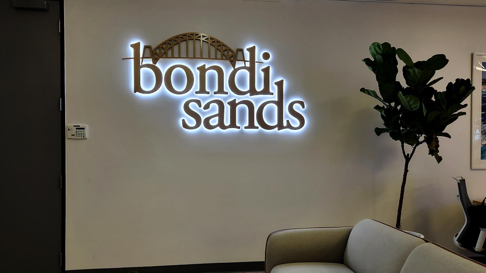 Bondi Sands light up sign attached to the wall