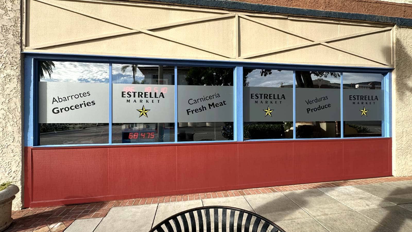 Estrella Market store signs attached to the window glass