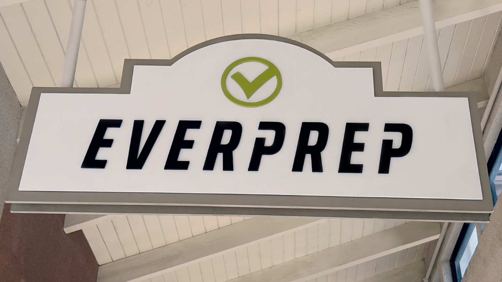 Everprep wooden sign hanging from the ceiling