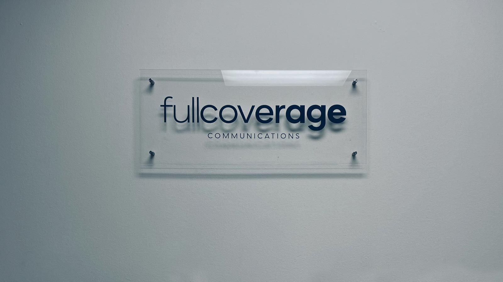 Full Coverage Communications interior sign for branding