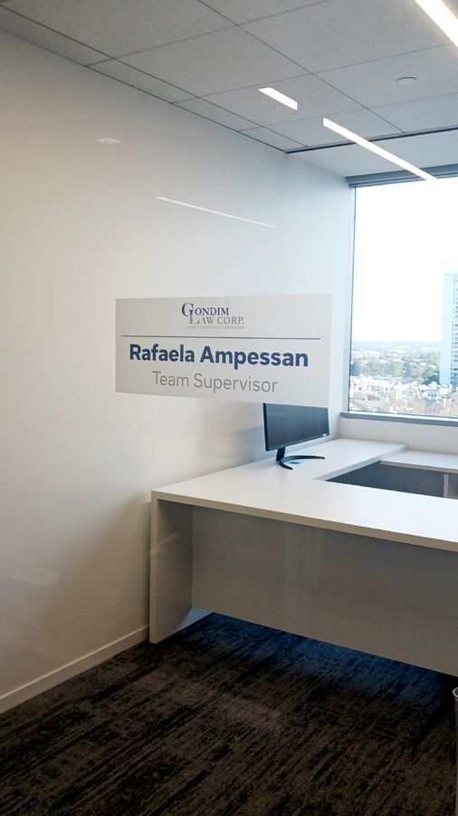 Gondim Law Corp custom decal attached to the glass wall