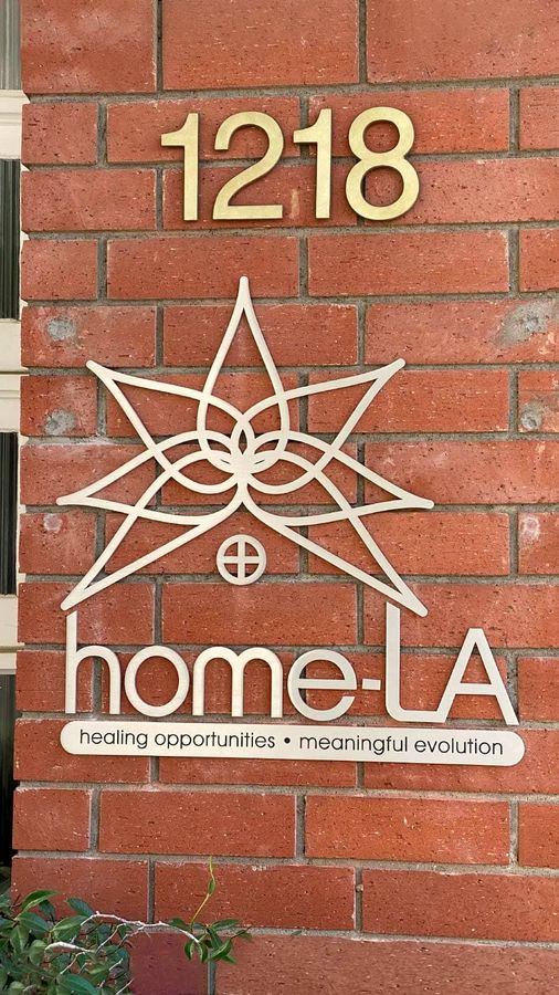 Home-LA outdoor sign mounted on the exterior wall