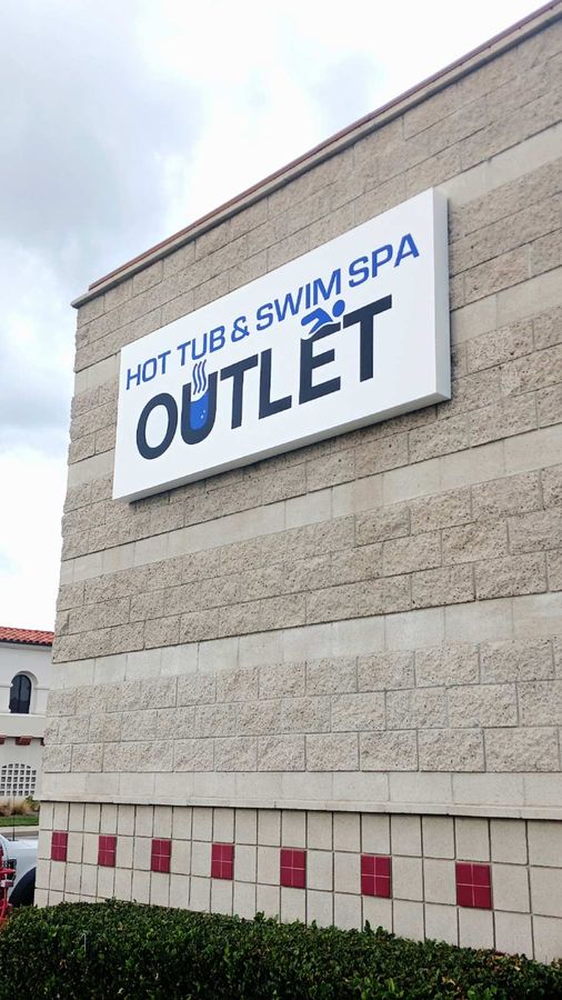 Hot Tub and Swim Spa Outlet building sign on the facade