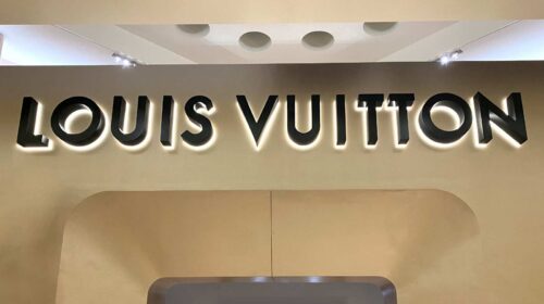 Louis Vuitton logo sign attached indoors