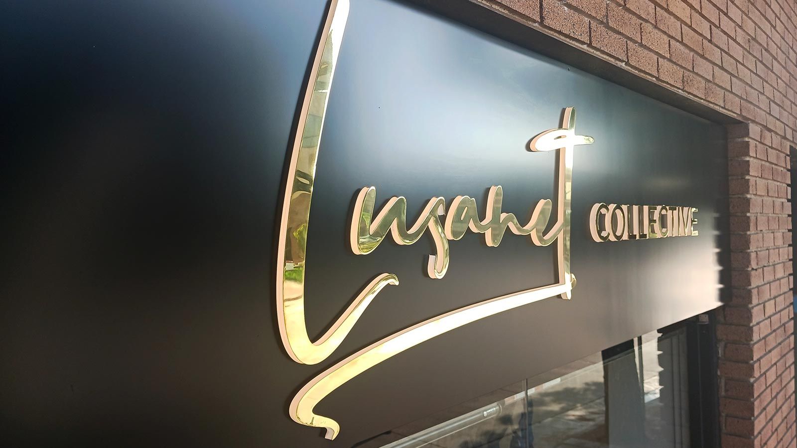 Lusanet Collective push through sign for storefront design
