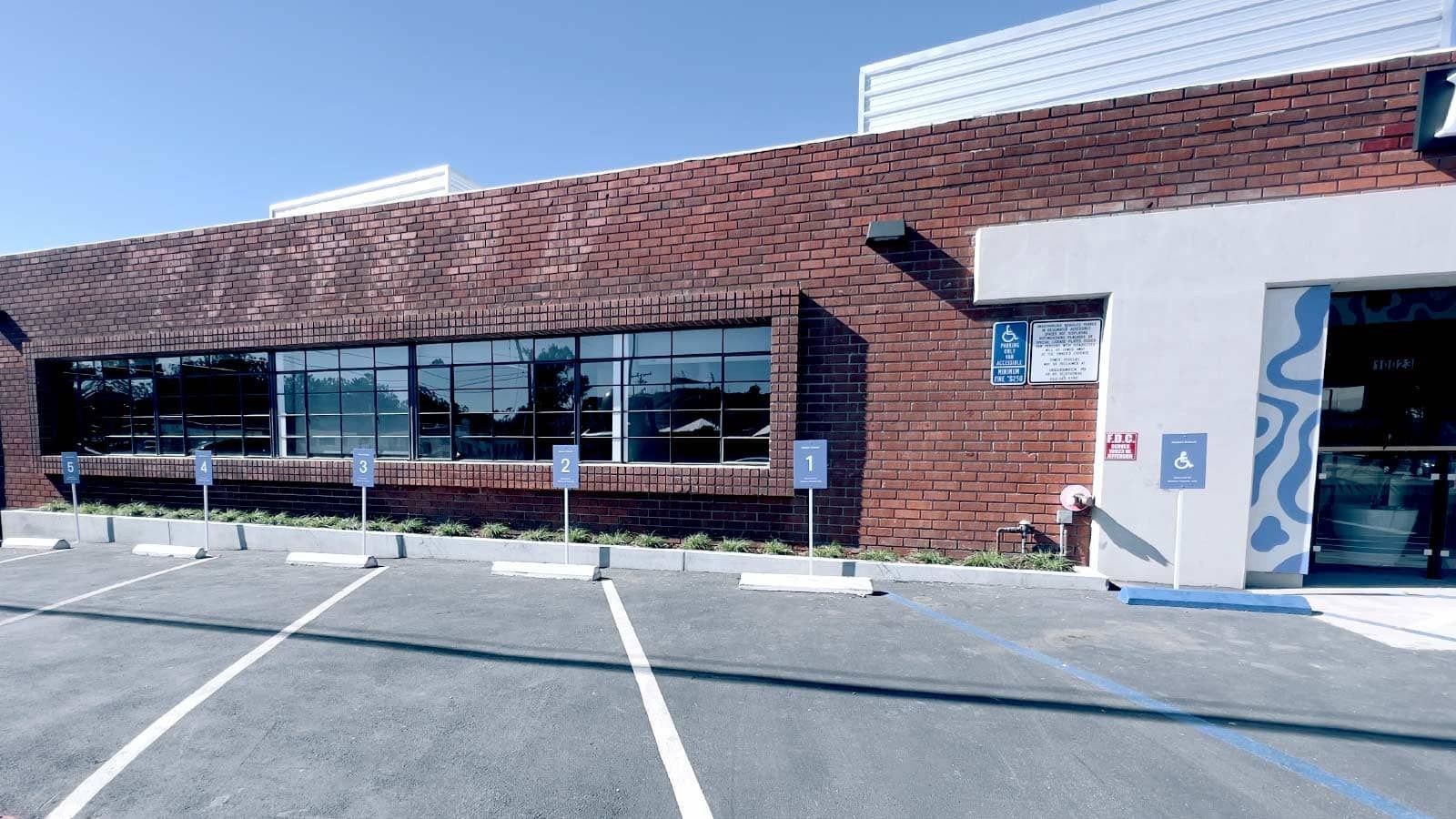 Modern Animal aluminum signs set up in the parking lot