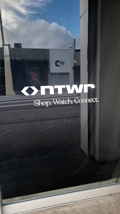 NTWRK vinyl lettering attached to the storefront glass