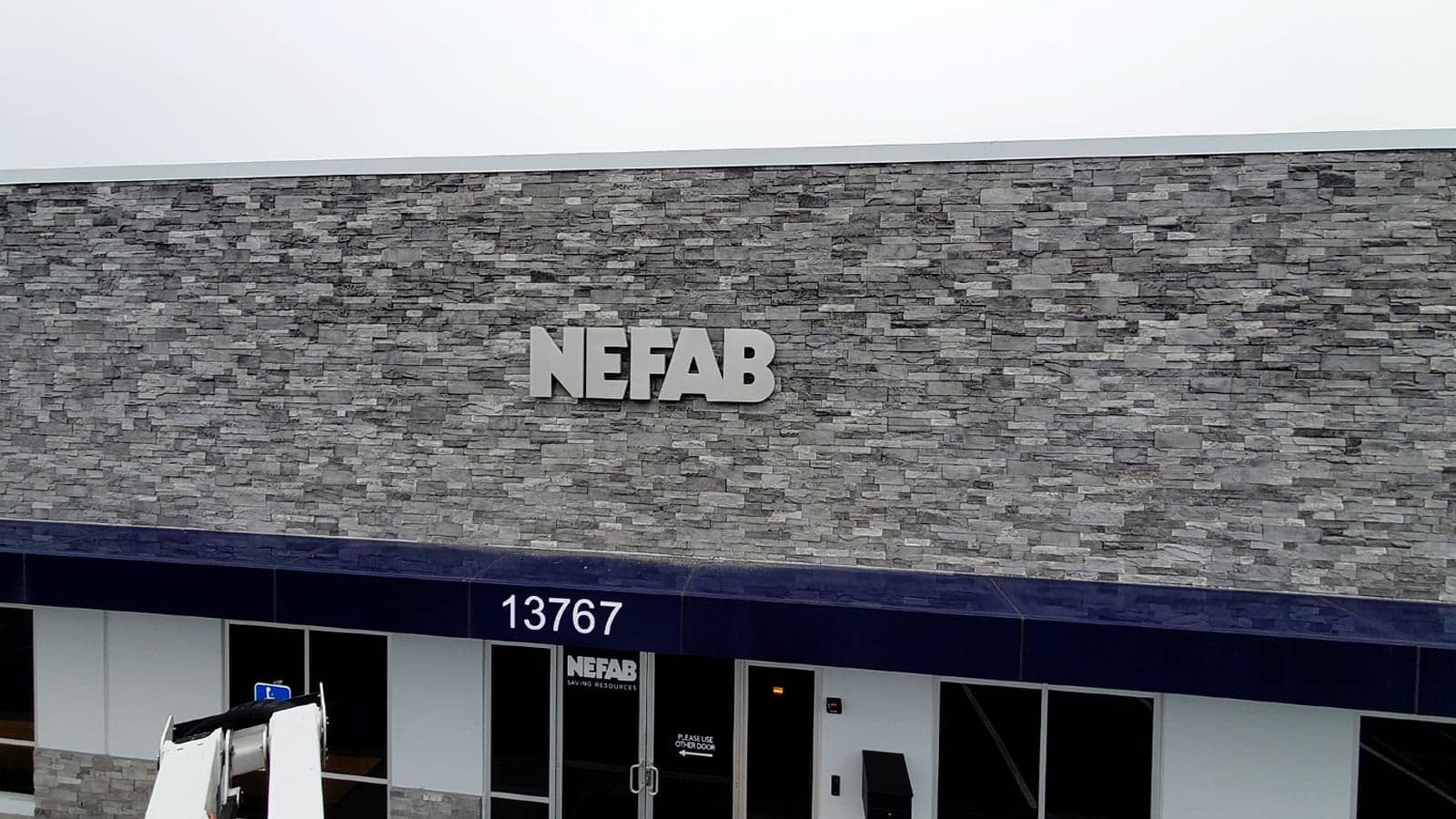 Nefab 3D sign mounted on the facade