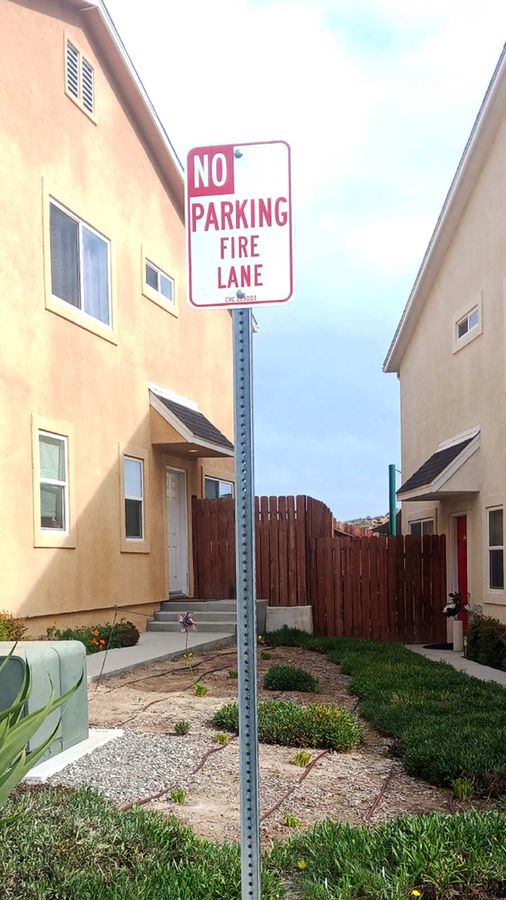 Regulatory parking sign installation outdoors