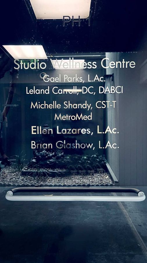 Studio Wellness Centre vinyl lettering applied to the glass