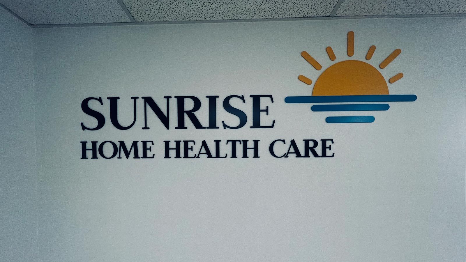 Sunrise Home Health Care office sign attached to the wall