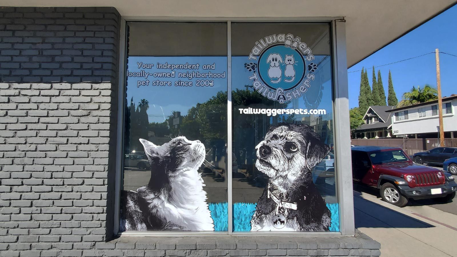 Tailwaggers store signs attached to the windows