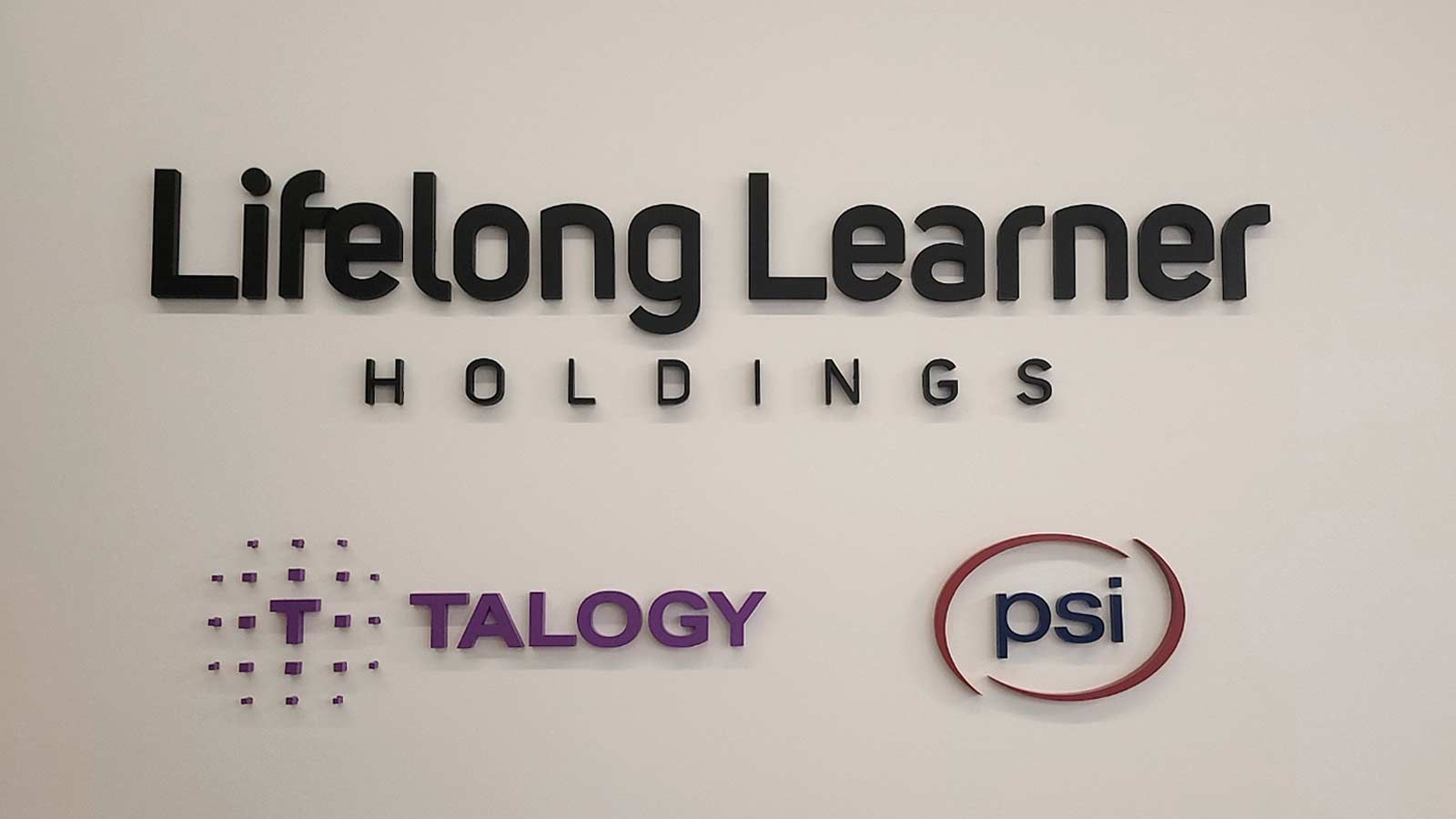 Talogy office sign attached to the wall
