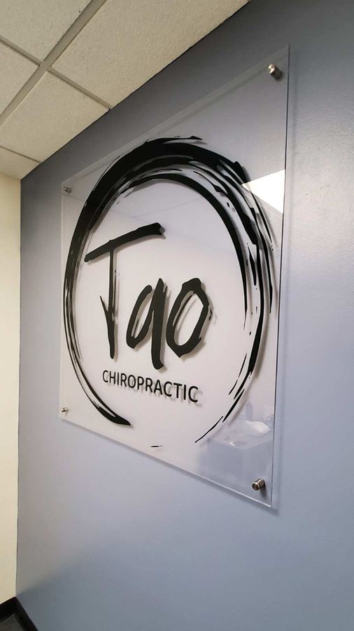 Tao Chiropractic interior sign attached to the wall