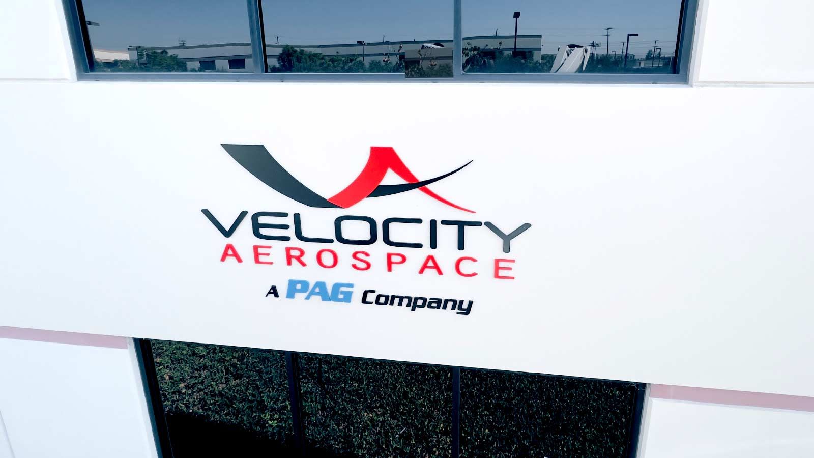 Velocity Aerospace building sign attached to the facade