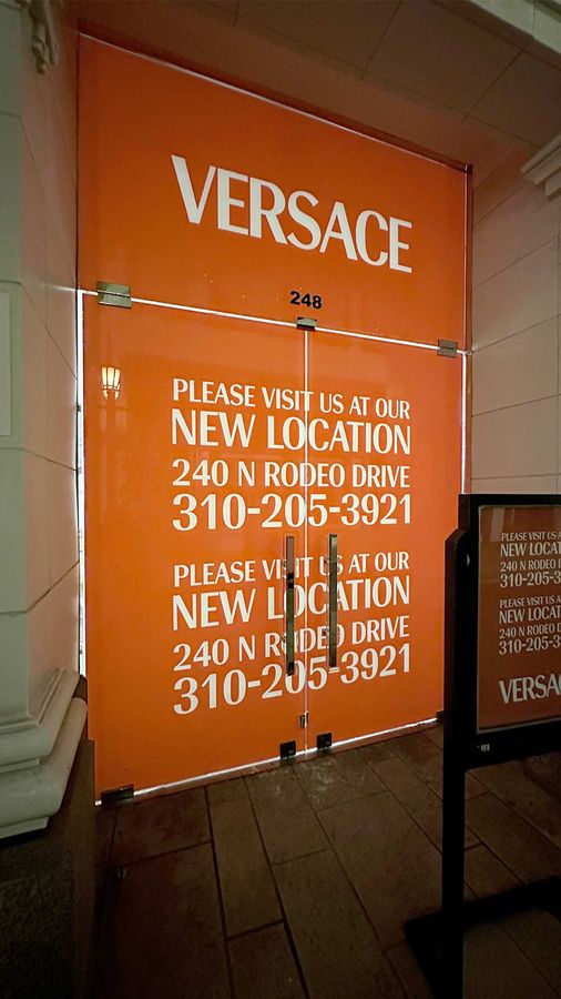 Versace store signs applied to the glass surface