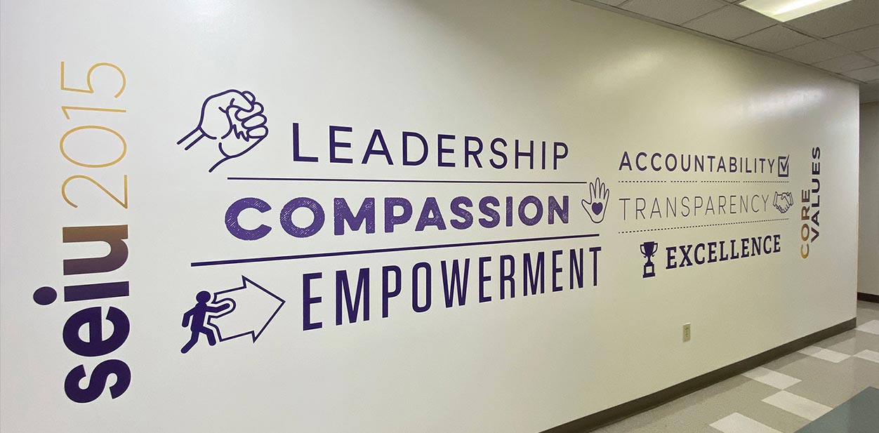 Seiu 2015 accent wall for office lobby displaying the brand's values on a white background