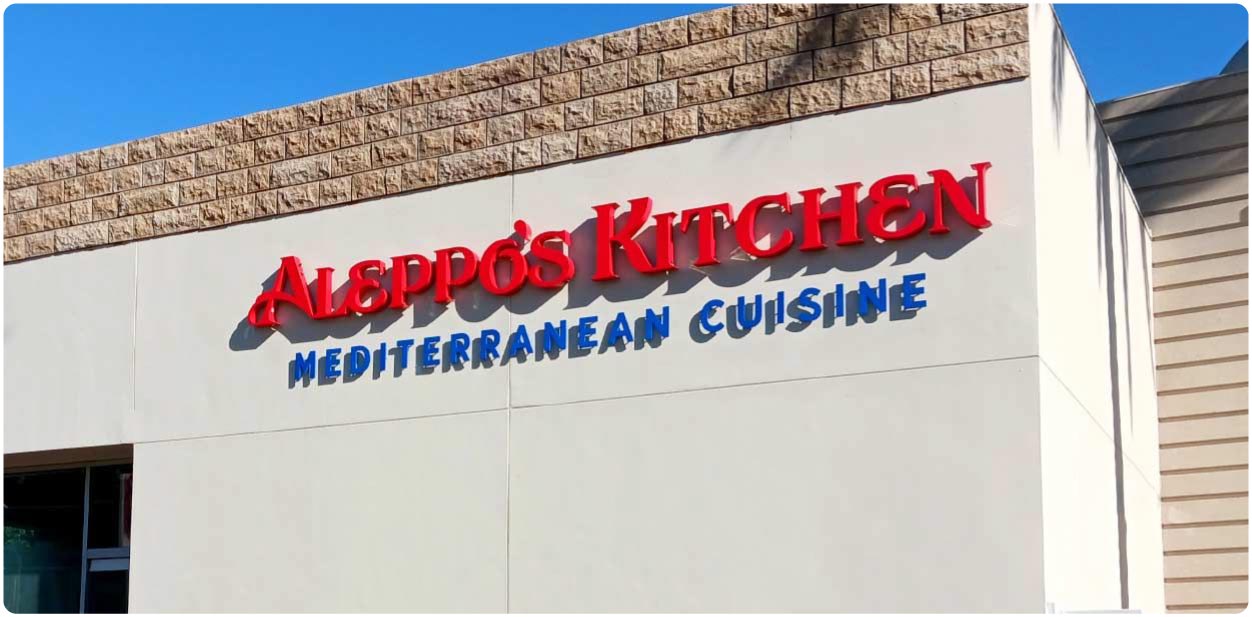 Aleppo's Kitchen branding design in red and blue featuring the brand name at the facade