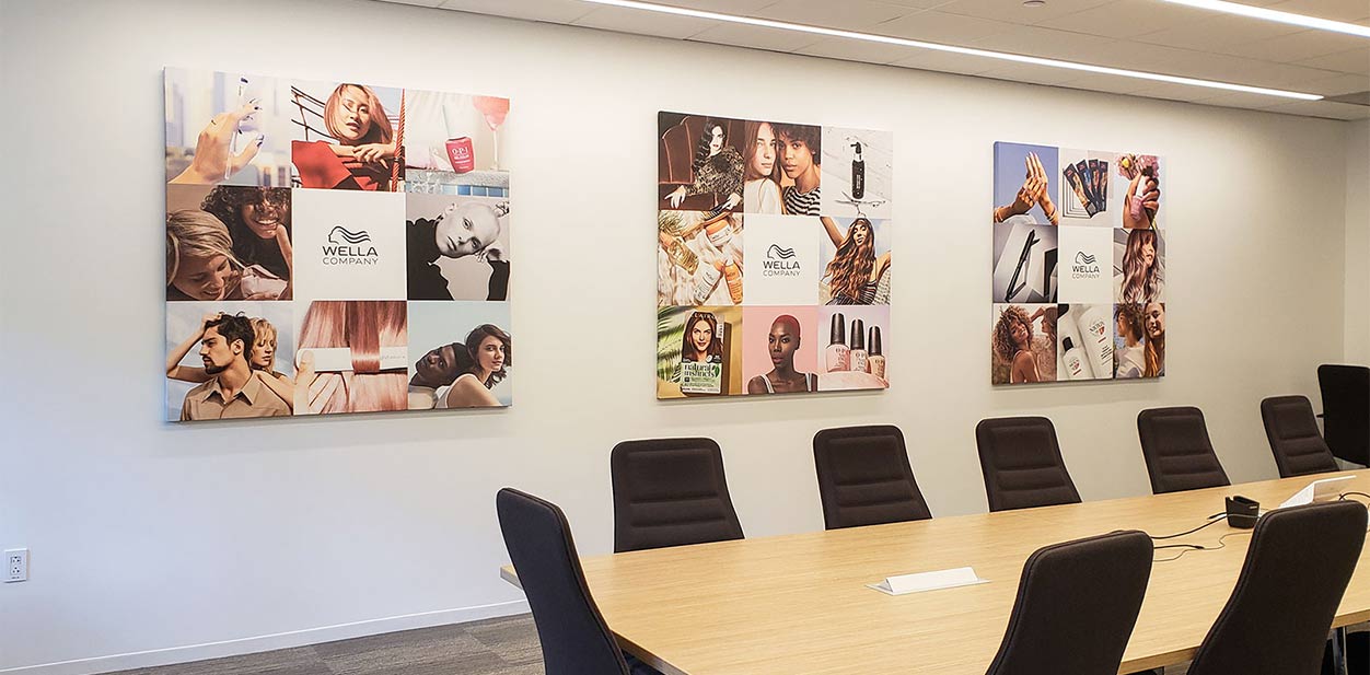 Wella office feature wall design with multi-pieced collage photo displays
