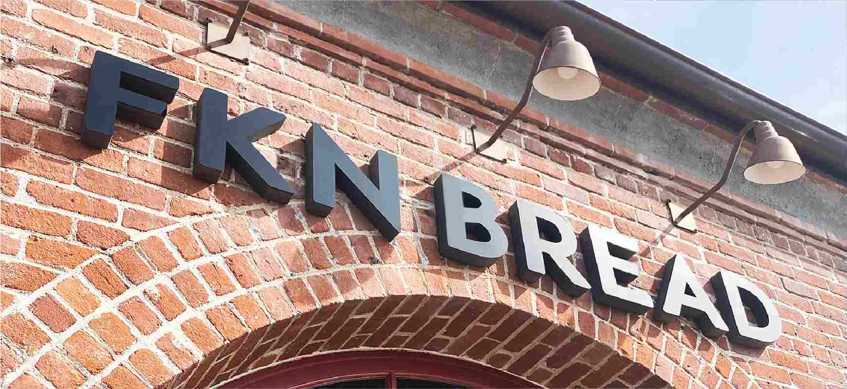 FKN Bread business letter sign in black spelling the brand name made of acrylic and foam board