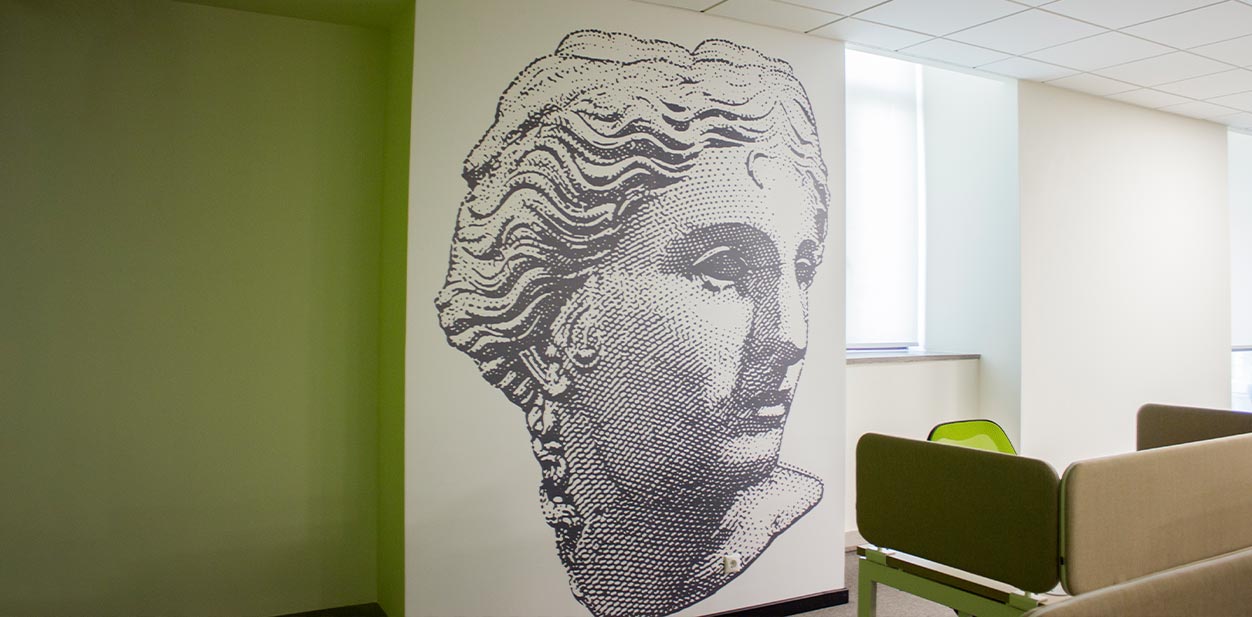 Pixel art feature wall design displaying Aphrodite on black and white graphics