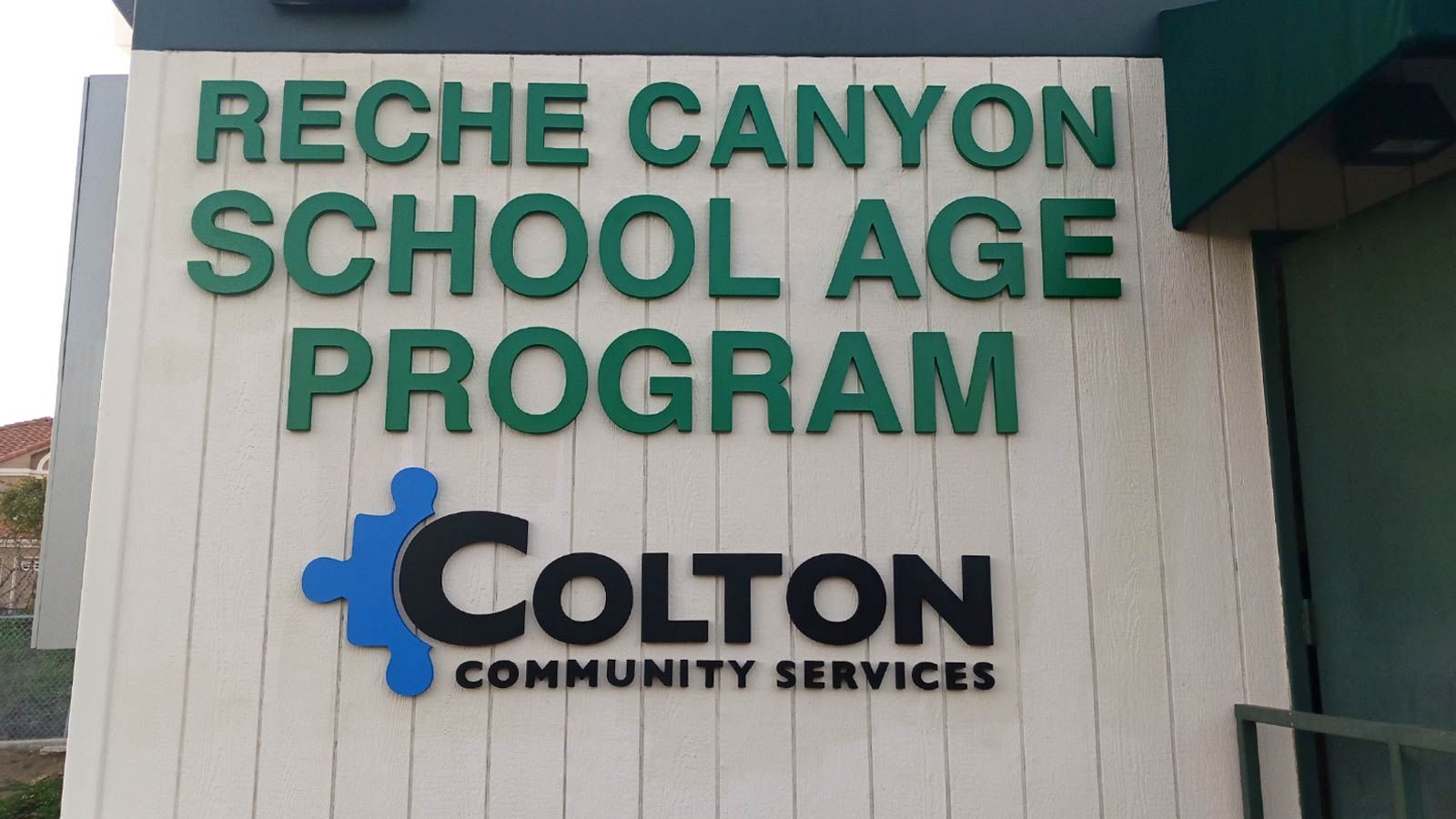 Coltion Community Services 3D sign attached outdoors