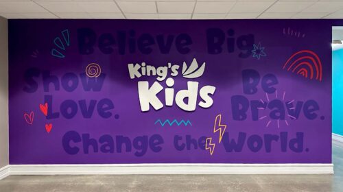 King's Kids office signs attached to the wall