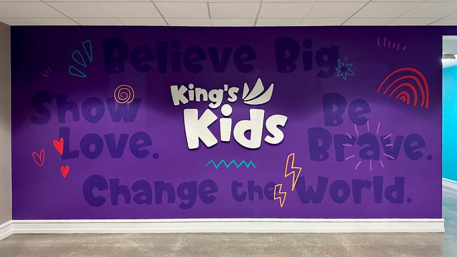 King's Kids office signs attached to the wall