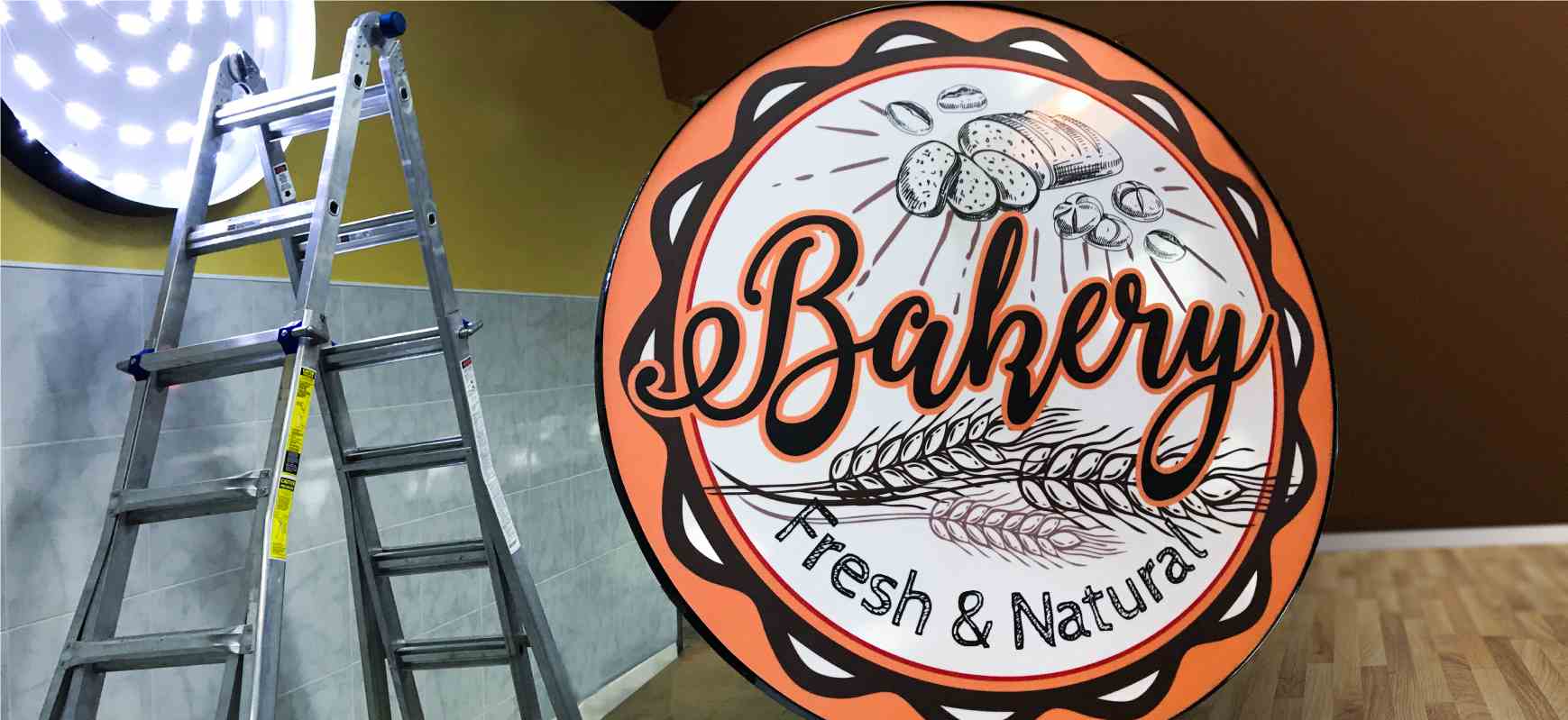 Bakery sign face replacement of a box display made of aluminum, backlit decal and acrylic