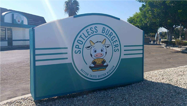 Spotless Burgers sign face replacement of a free-standing outdoor display made of lexan