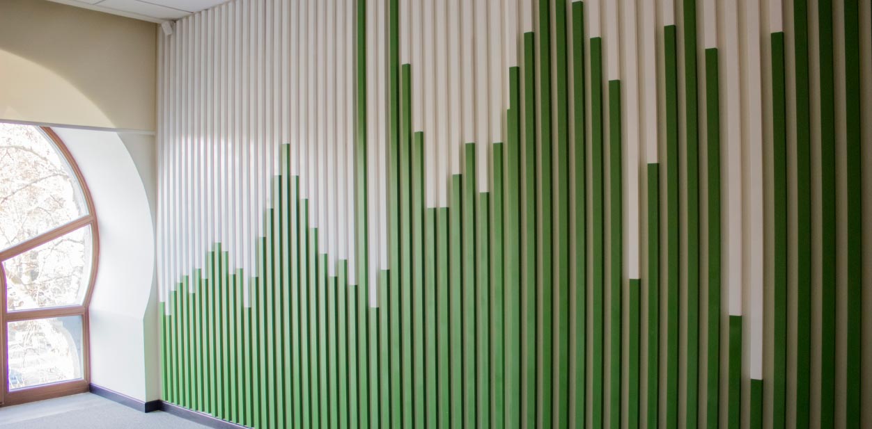 White and green accent wall design with wood vertical slats covering the whole wall