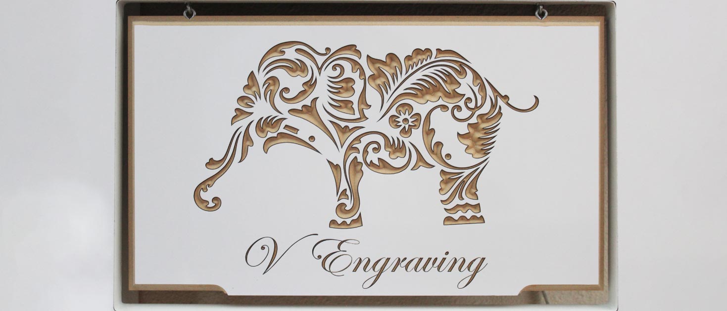 High-precision CNC engraving on wood with an image of an elephant for branding