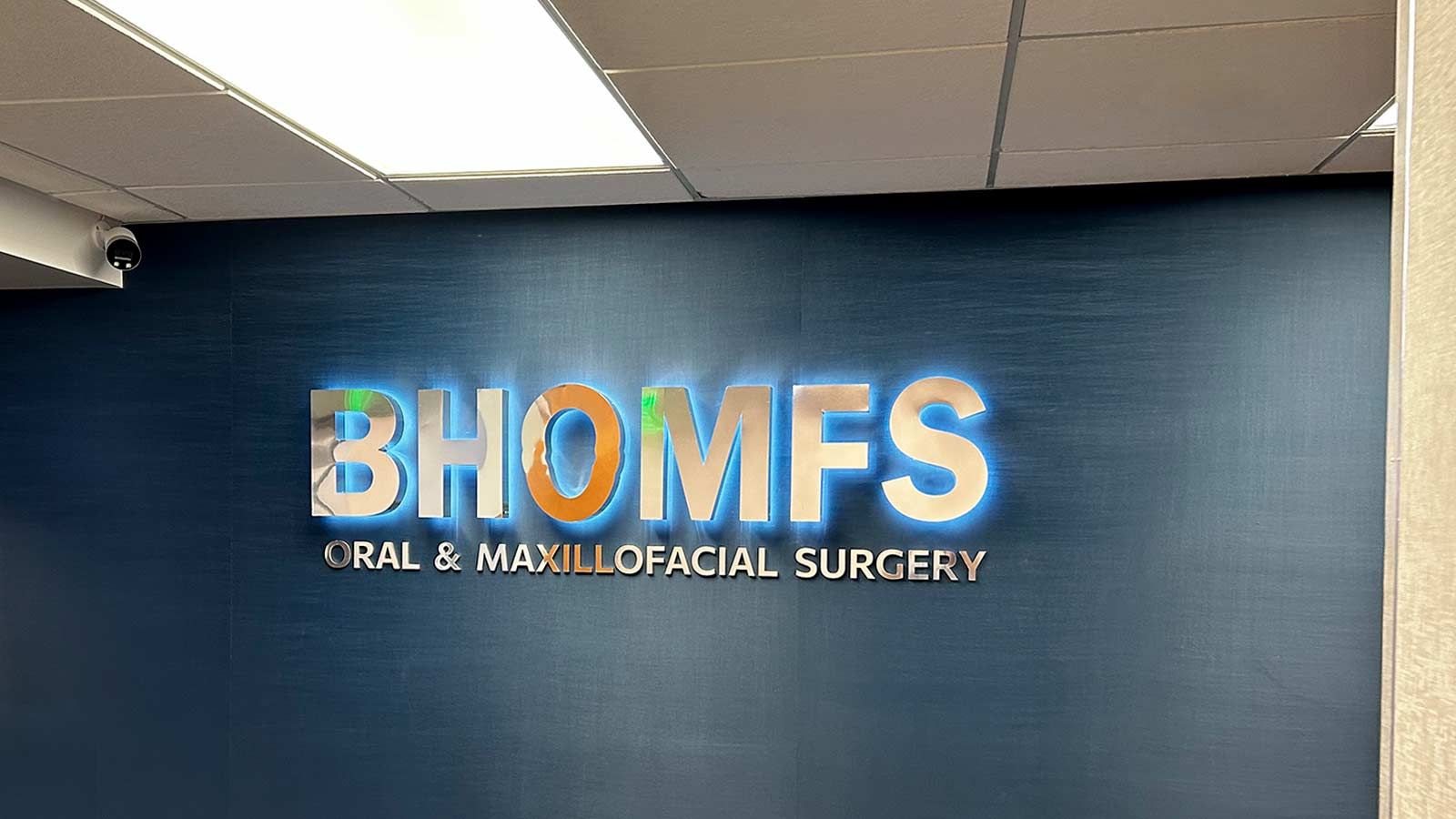 BHOMFS 3D sign attached to the office wall