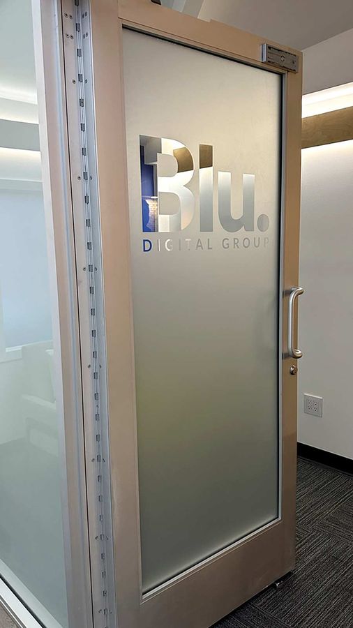 Blu Digital Group interior sign applied to the door glass