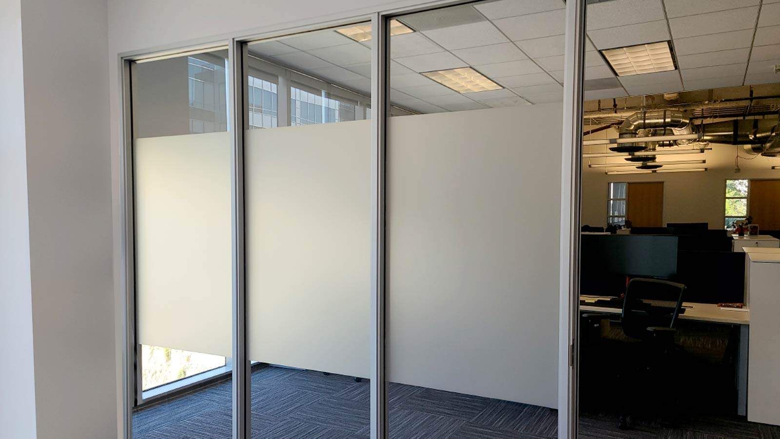 Blu Digital Group office signs attached to the glass