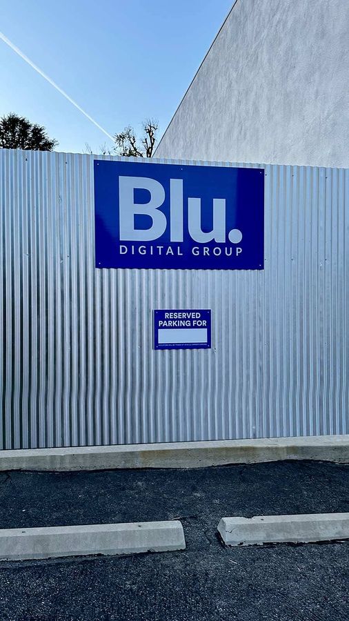 Blu Digital Group outdoor signs installed on the wall