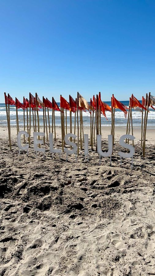 CELSIUS wooden sign installed on the beach