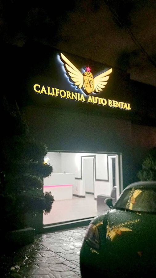 California Auto Rental light up sign fixed to the storefront