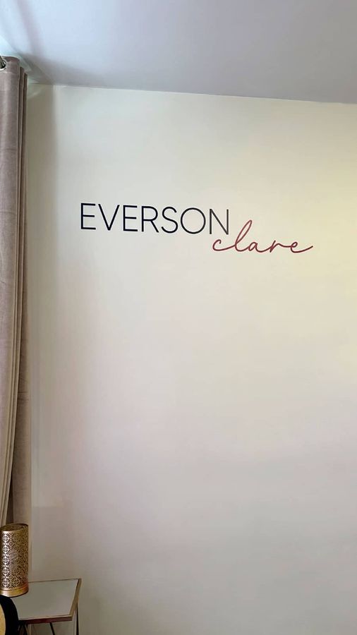 Everson Clare Boutique interior sign decorating the wall