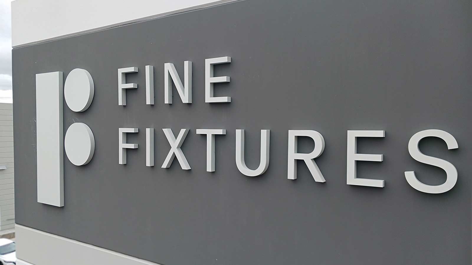 Fine Fixtures high rise sign installation on building top
