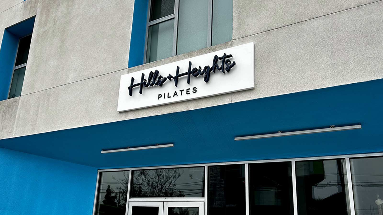 Hills and Heights Pilates outdoor sign on the facade