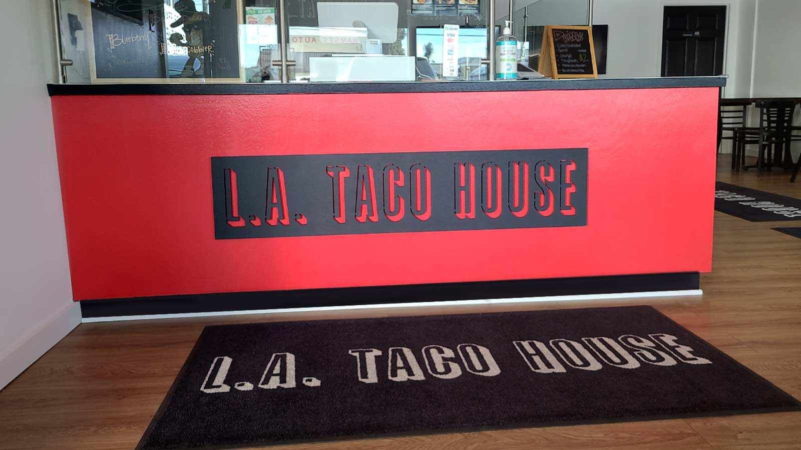 L.A. Taco House restaurant sign installed indoors