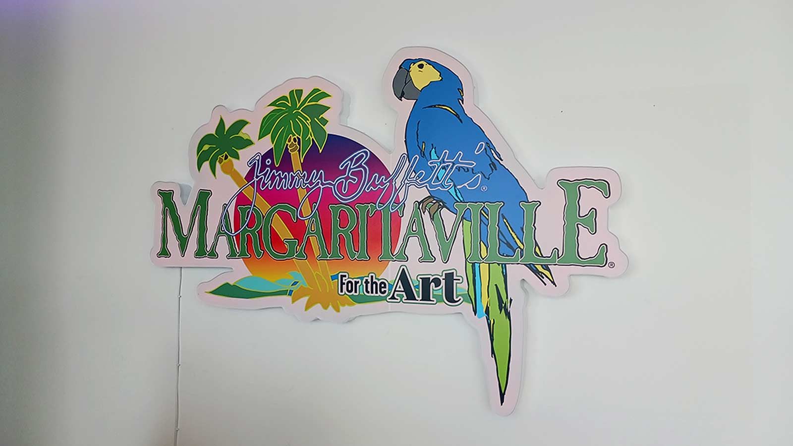 Margaritaville light up sign attached to the wall