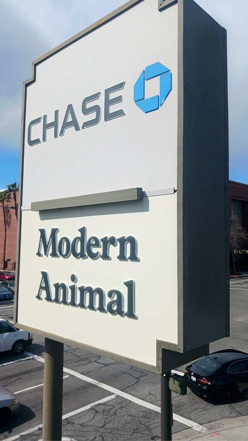 Modern Animal pylon sign installed outdoors