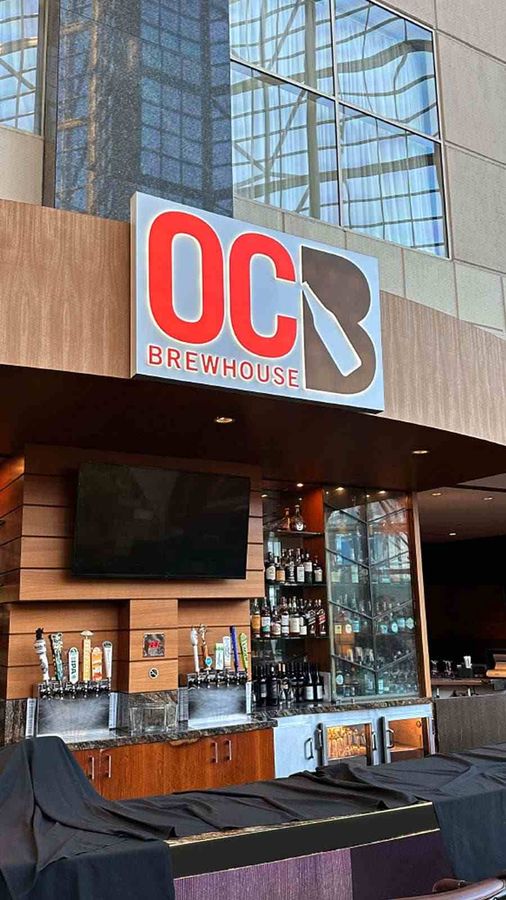 OC Brewhouse light box sign installed on the exterior wall