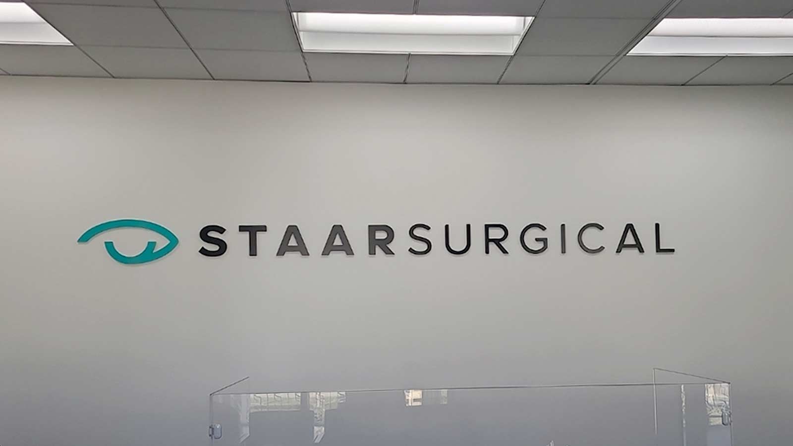 Staar Surgical acrylic sign mounted on the office wall